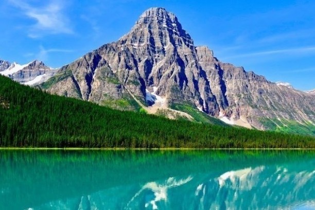 water next to a mountain