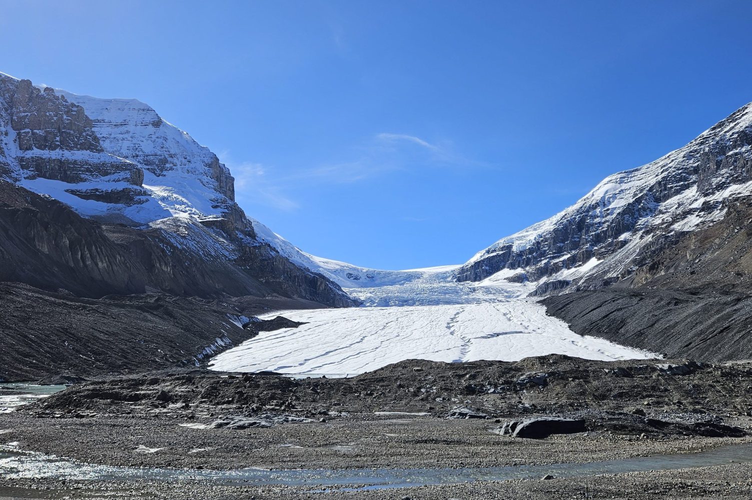 The columbia icefields, a glacier carving through a mountain on The Icefields parkway