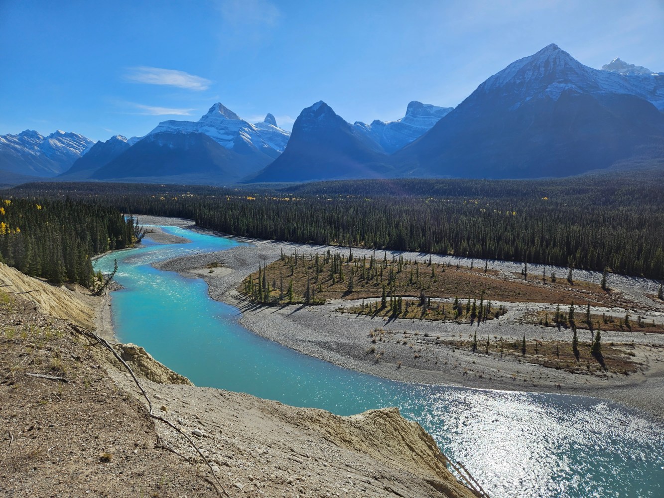 A turquoise river flowing through the mountains on The Icefields Parkway